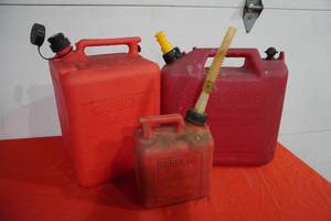 lot 179 image: Two 5 gal poly gas cans and one small one