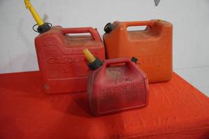 lot 180 image: Two 5 gal poly gas cans and one small one