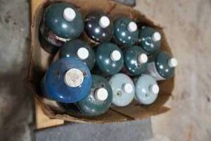 lot 209 image: 12) One lb propane tanks -appear full