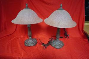 lot 49 image: Two lamps, cast base with glass shades