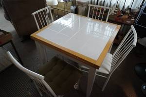 lot 51 image: Ceramic Top table wfour chairs 36 square to 60