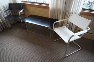 lot 63 image: Coffee table and two arm chairs