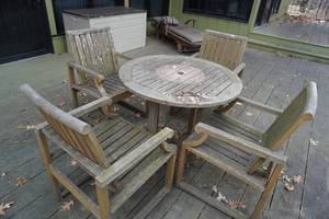 lot 71 image: Round wood table, four chairs & recliner on deck