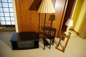 lot 122 image: TV stand, step display with lamp, bed table, lamp