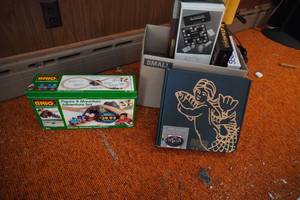 lot 174 image: Wood train and box of games