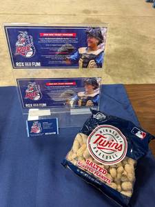 lot 27 image: 4 general admission tickets to the Rox games with a pack of salted roasted Peanuts