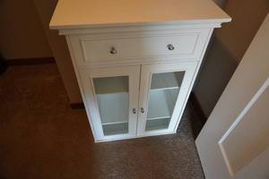lot 122 image: Small White two door cabinet 24 W x 12 D x 32 T