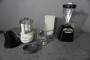 lot 45 image: Oster blender, Cuisinart chopper, cracker box