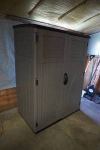 lot 92 image: Two door Poly Storage shed. 3 shelves, 52 W x 32 D x 72 T