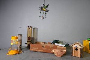 lot 287 image: Bird feeders and house, chime, sprinkler