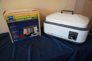 lot 166 image: 18 Qt Nesco roaster and pressure cooker