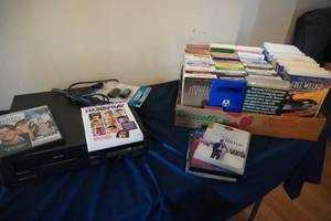 lot 205 image: VCR Magnavox and tapes, DVDs