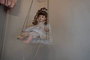 lot 231 image: Doll on a swing