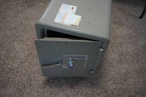 lot 242 image: Sentry combination safe with combo on rollers