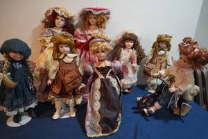 lot 287 image: Eight fancy dolls on stands