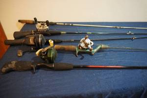 lot 302 image: Four fishing rods & reels, Johnson Sentury & more