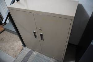 lot 337 image: Double door metal cabinet with three shelves