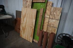 lot 43 image: Wood along wall & three rolls gasket material