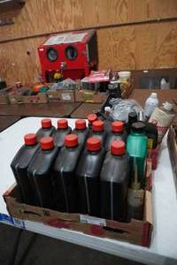 lot 62 image: Two boxes of oil and shop supplies