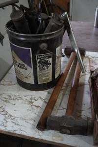 lot 74 image: Two mauls and bucket of grease guns