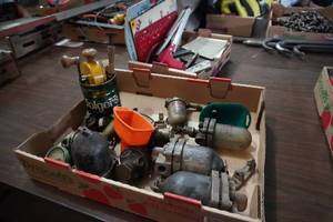 lot 83 image: Fuel filterswater separators, metal signs &amp Model T books