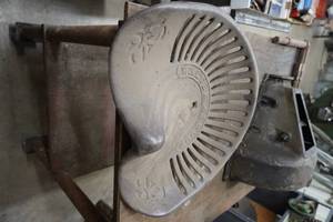 lot 125 image: Walter A Wood Cast iron seat, hog hub for T and table