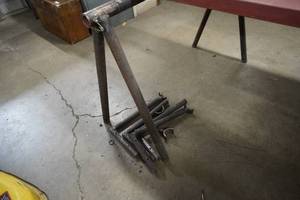 lot 150 image: Set of steel saw horses-48 w axle lift brackets